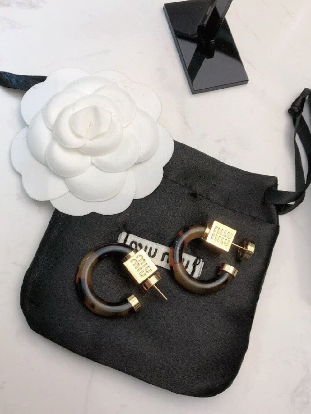 Miu Miu Tortoiseshell Lucite Hoop Earrings with Gold-Logo Accents - Picture 5 of 6